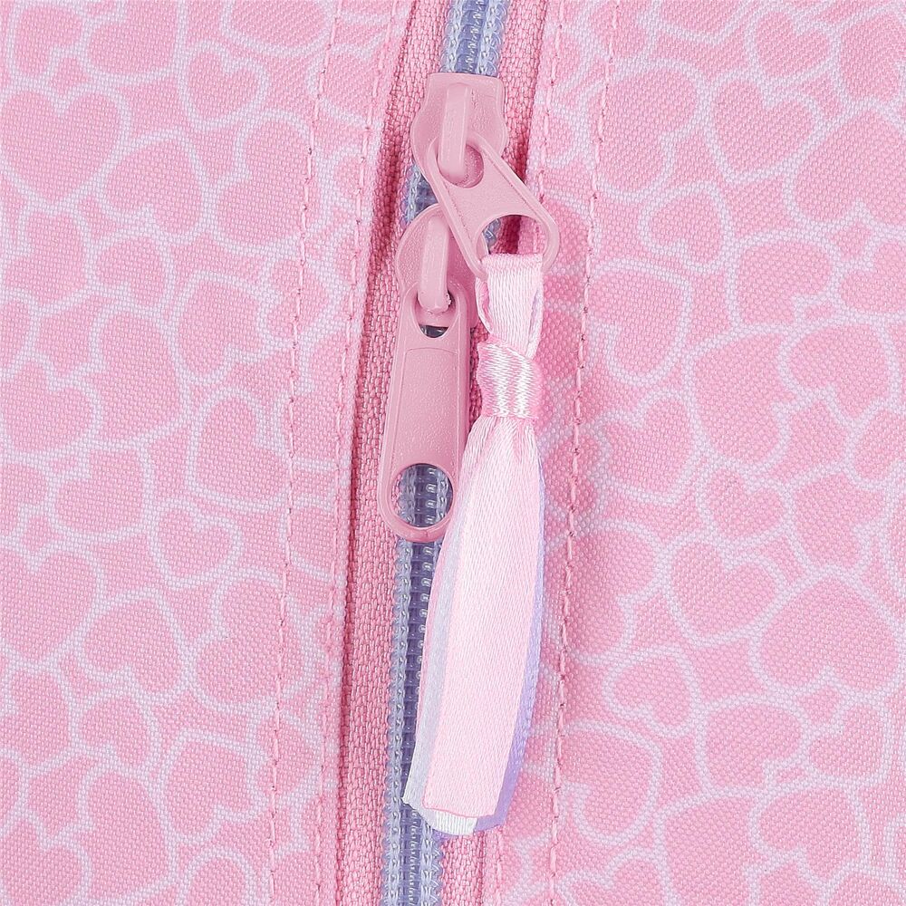 Motifs cœurs et pois colorés imprimés sur la surface de la trousse