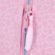 Motifs cœurs et pois colorés imprimés sur la surface de la trousse