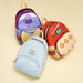 Coquillages puka authentiques fixés sur le sac à dos Moana Loungefly pour une touche polynésienne