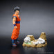 Présentation de la figurine Son Gohan sur socle avec éclairage mettant en valeur les détails