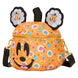 Sac Loungefly Disney Minnie Citrouille posé sur une surface neutre avec éclairage mettant en valeur les couleurs