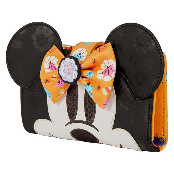 Vue latérale du portefeuille Minnie Citrouille montrant l'épaisseur et la fermeture sécurisée