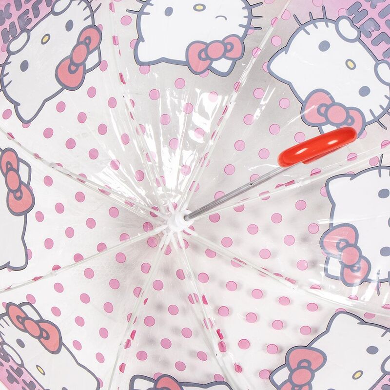 Parapluie Hello Kitty posé sur une surface blanche, montrant le design complet