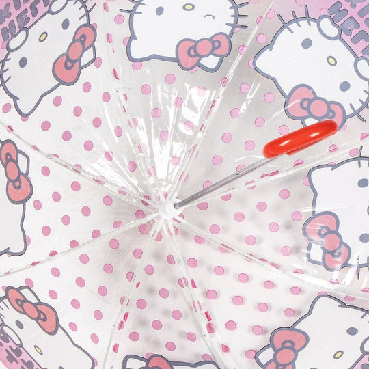 Parapluie Hello Kitty posé sur une surface blanche, montrant le design complet