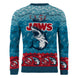 Détail du motif requin et flocons sur le pull de Noël Jaws