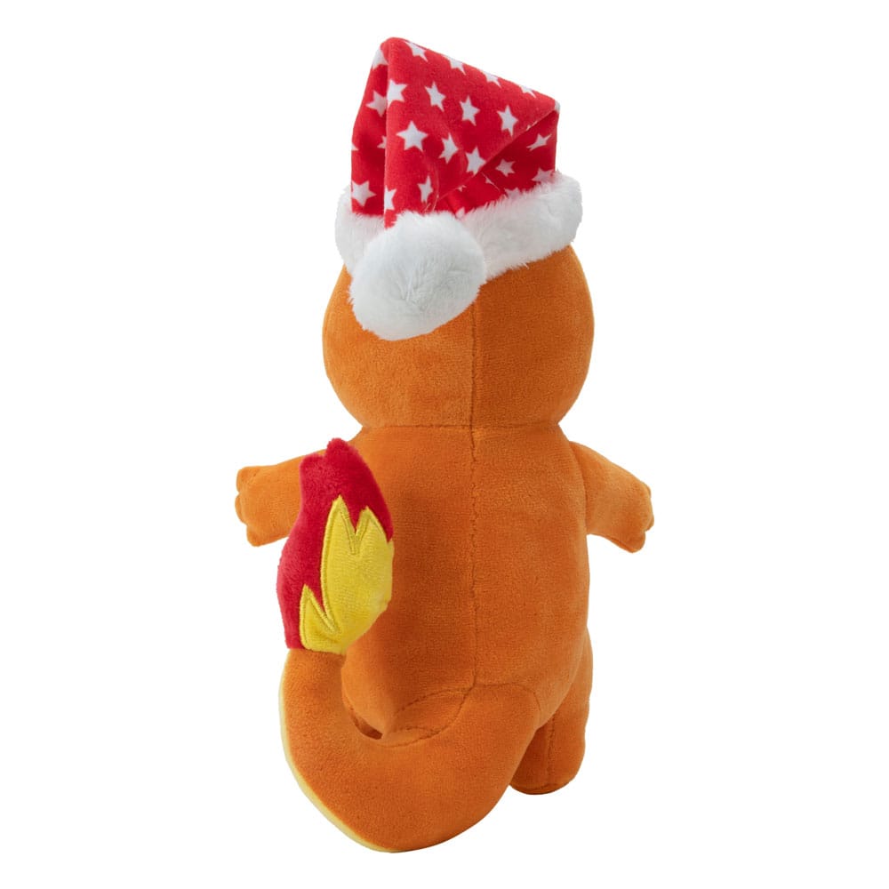 Gros plan sur le visage de la peluche Salamèche Pokémon et son bonnet de Noël festif.