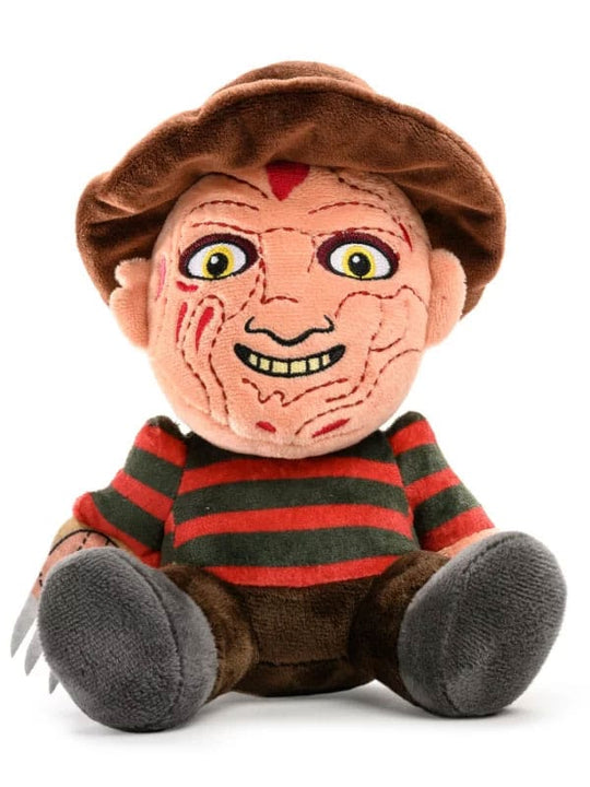 Peluche Freddy Krueger Phunny Sitting 20 cm de Kidrobot, représentant le personnage des Griffes de la Nuit assis, avec son pull rayé, son chapeau et son gant à griffes emblématique.