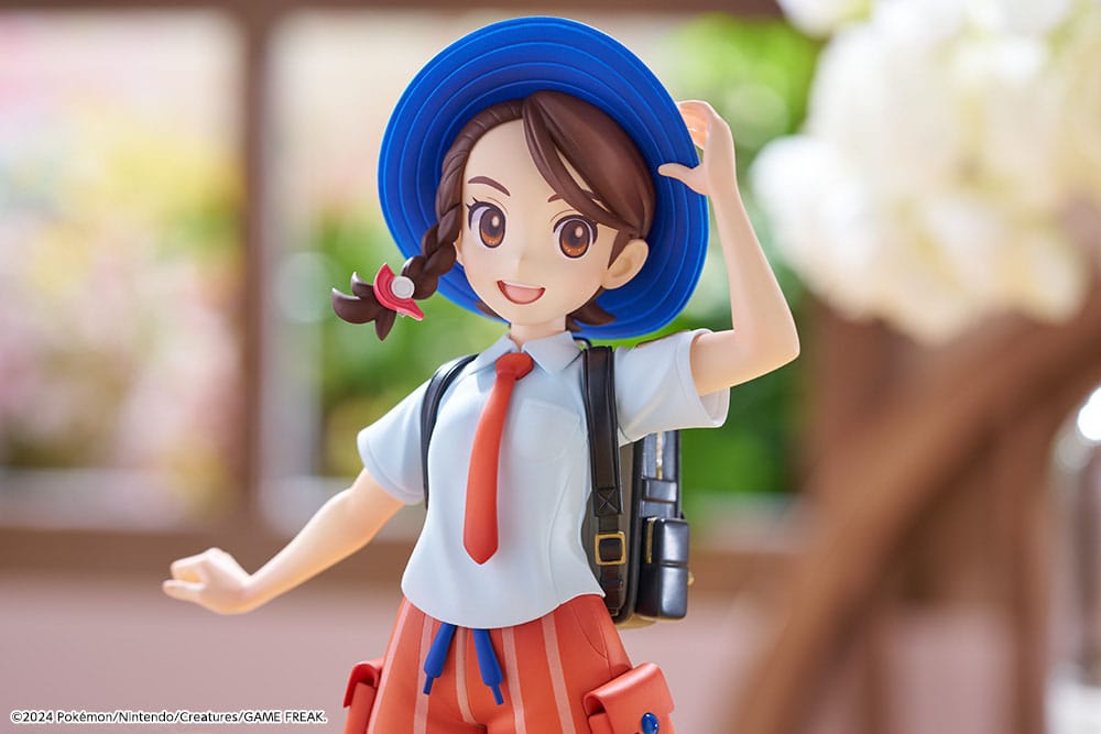 Statuette Pokémon Juliana et Sprigatito, gros plan sur le visage