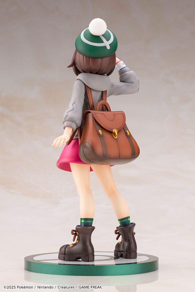 Vue arrière de la statuette Gloria et Larméléon, détails des cheveux et sac