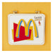 Pins émaillés Loungefly McDonalds Happy Meal affichés sur un sac à dos