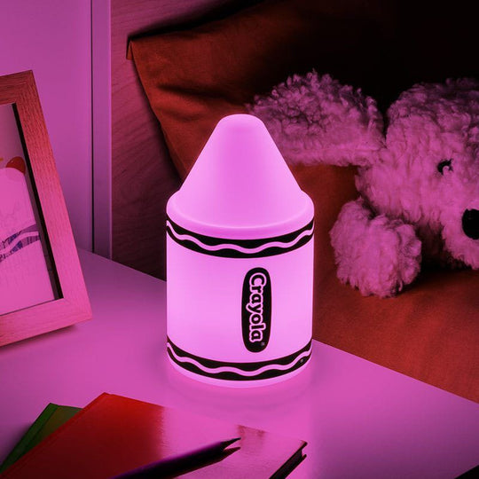 Lampe décorative Crayola Squishy Glo 18 cm posée sur une table de chevet