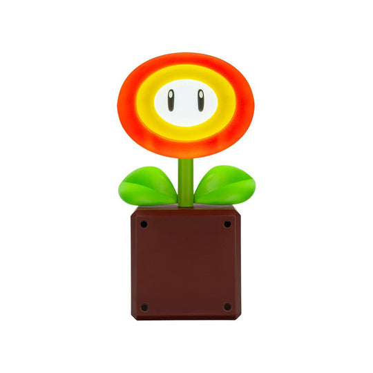 Lampe Super Mario Fire Flower allumée sur une table